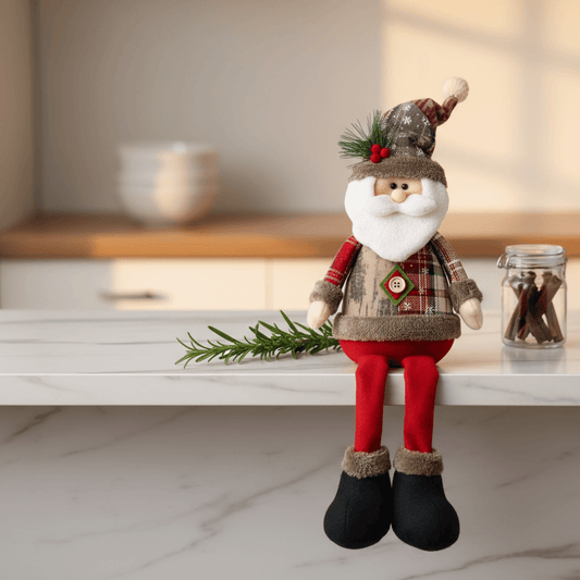 boneco de natal papai Noel sentado na bancada com ramos e canela