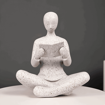 Escultura abstrata leitor meditação resina branca cinza biblioteca Casa Vértice