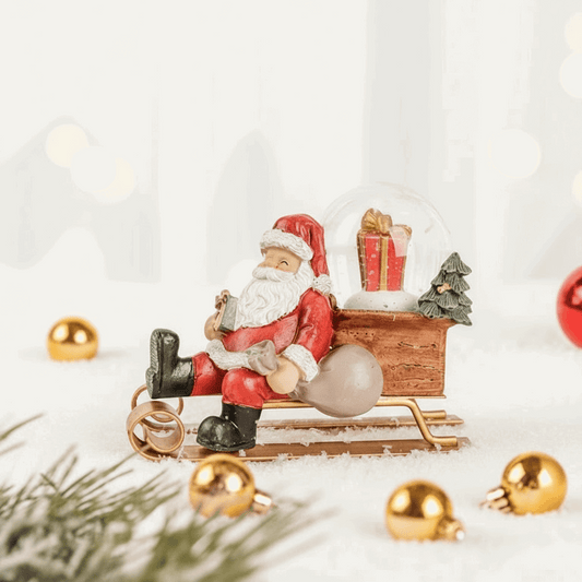 estatueta Papai Noel no trenó em resina multicolor fundo branco 10,5×6×8 cm