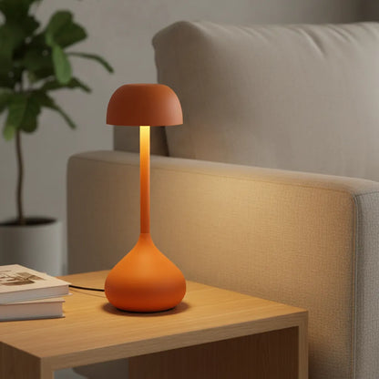 Luminária de mesa sem fio Mushroom Touch laranja terracota em jantar sofisticado.